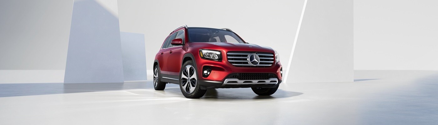 Red Mercedes-Benz GLB parked in a modern placeless space