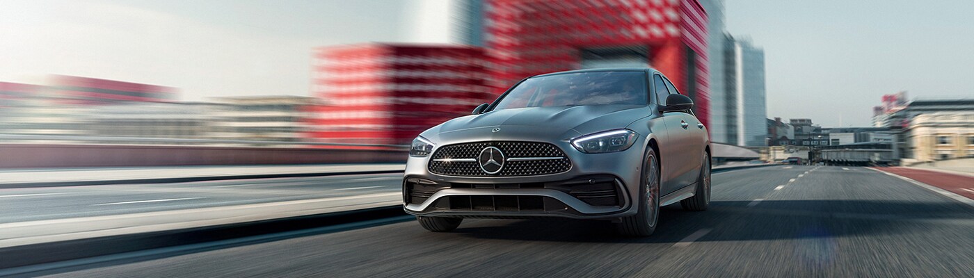 Mercedes-Benz C-Class driving on a city street